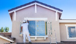 House Painter Working on House
